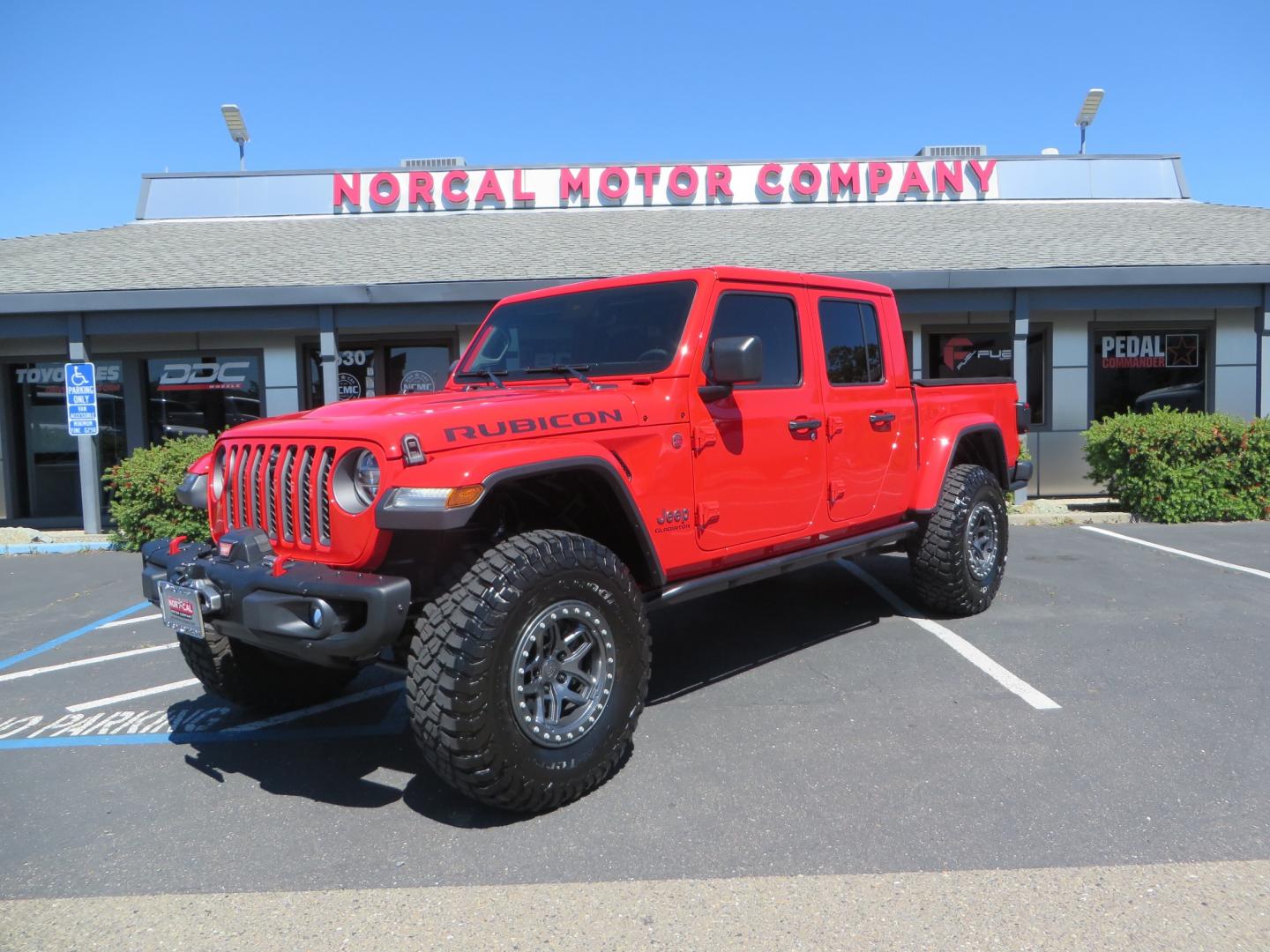 2020 Red /black Jeep Gladiator Rubicon (1C6JJTBG6LL) with an 3.6L V6 DOHC 24V engine, 6M transmission, located at 2630 Grass Valley Highway, Auburn, CA, 95603, (530) 508-5100, 38.937893, -121.095482 - Rubicon Gladiator featuring a Mopar suspension system with Fox shocks, 17" AEV wheels wrapped in 37" BFG tires, Warn Winch, Rock sliders, Cascade front license plate holder, Impact bedliner, Built Right Industries bed Molle panels, and Window tint. - Photo#0